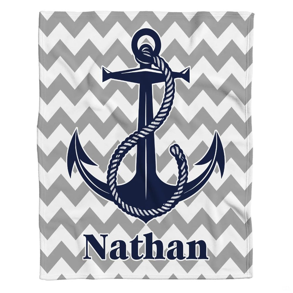 thematic accent bedroom scene styling showing the gray and white chevron geometric backdrop with navy blue anchor motif.