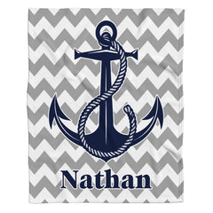 thematic accent bedroom scene styling showing the gray and white chevron geometric backdrop with navy blue anchor motif.