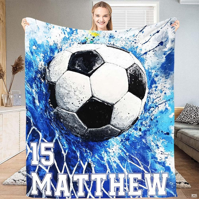 Soccer ball bursting into goal net with energetic royal blue splatter artwork.