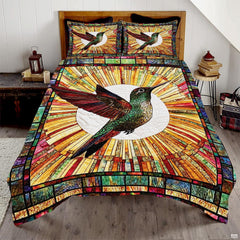 Green and red hummingbird before a white circle and amber mosaic sunburst