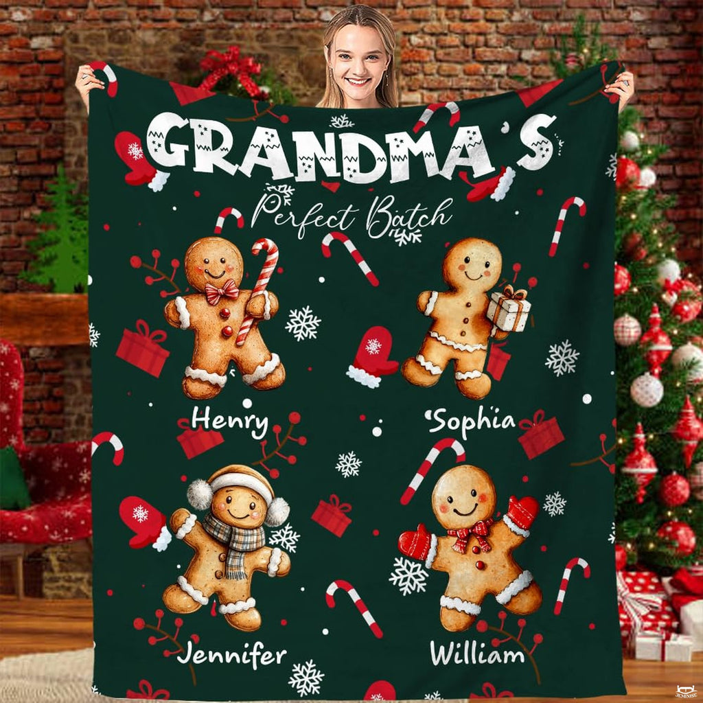 Christmas gingerbread cookies throw blanket featuring four festive cookie figures on an evergreen background.