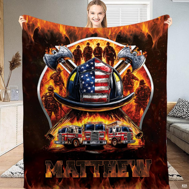 Firefighter helmet with American flag shield, crossed axes, and fire trucks graphic print on Blanket.
