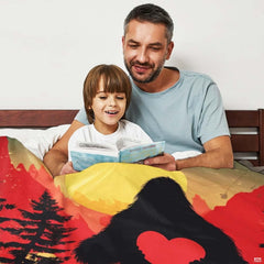 Bigfoot holding heart throw blanket view 3 highlighting Sasquatch silhouette, scarlet heart, and sunset sky