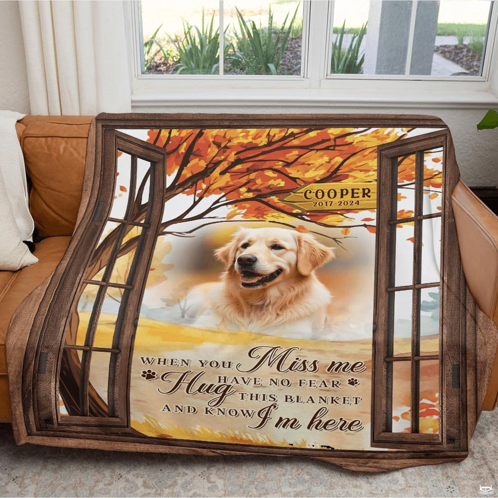 Bedroom setting displaying canine sympathy throw blanket spread across a bed beside a puppy.