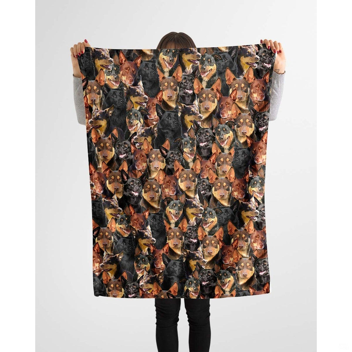Australian Kelpie photo collage blanket styled across a couch in a bright room.