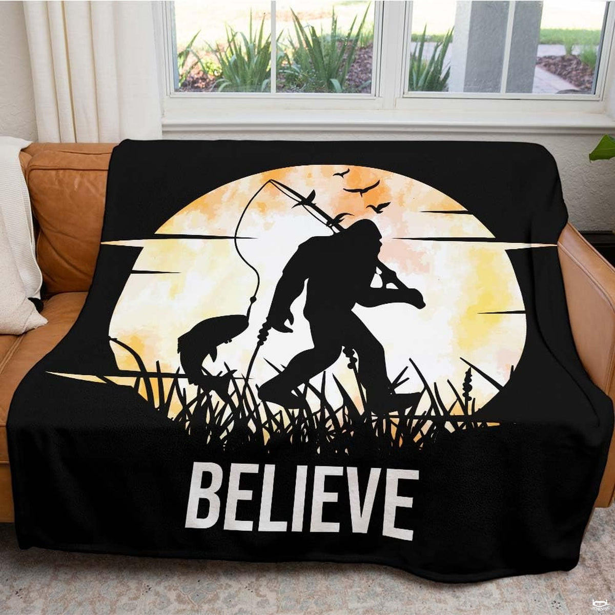 Close up of fishing Bigfoot throw blanket highlighting amber moon and silhouetted angling gear