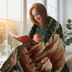 Close-up view of the rustic grizzly bear family illustration and stylized evergreen pine branches in deep earth tones.