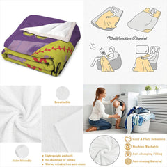Neatly folded purple softball throw blanket displayed on wooden surface showcasing clean edge borders