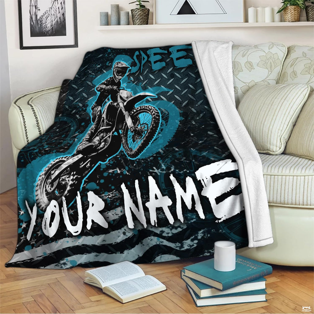 Overhead view of motocross dirt bike bedding set displaying bold airborne rider and patriotic grunge stripes.