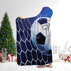 Full-length display of soccer ball and net design shown in a holiday room setting with decorated tree.