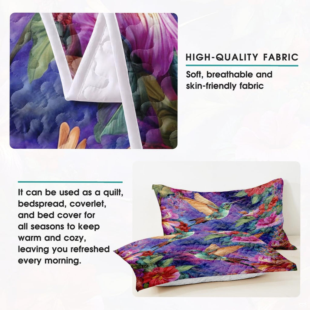 Pillow display with hummingbirds, colorful flowers, and leaves