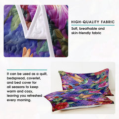 Pillow display with hummingbirds, colorful flowers, and leaves
