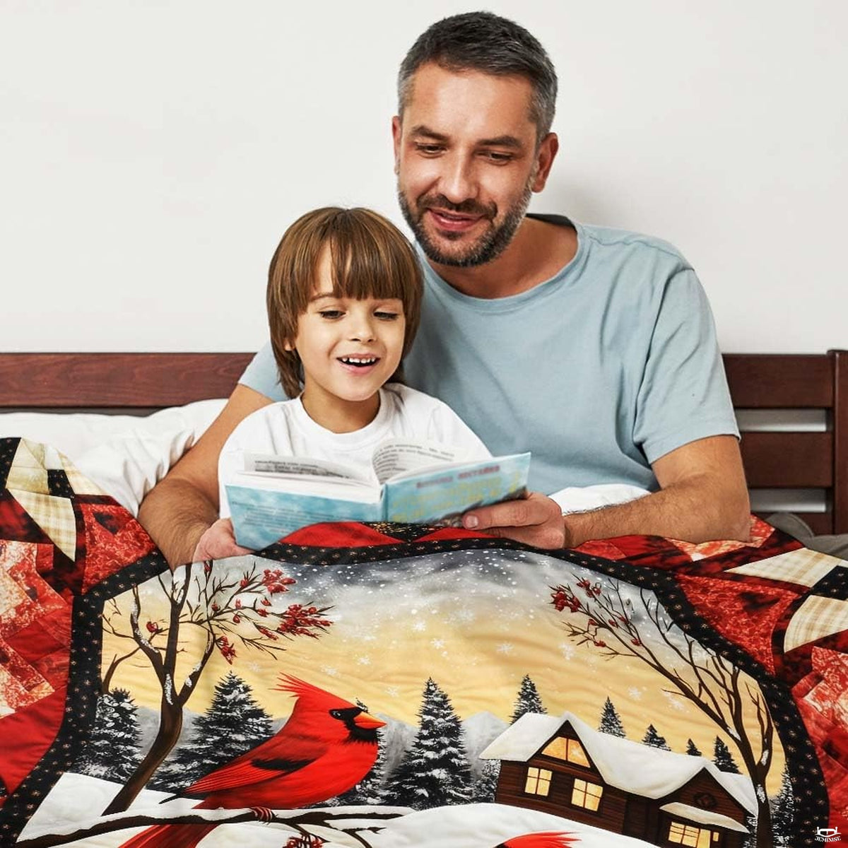 Scenic woodland lodge with glowing windows and falling snowflakes on rustic cabin bedding.