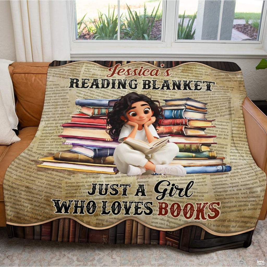 Bedroom styling shot showing the vintage book blanket arranged across the foot of a styled bed.
