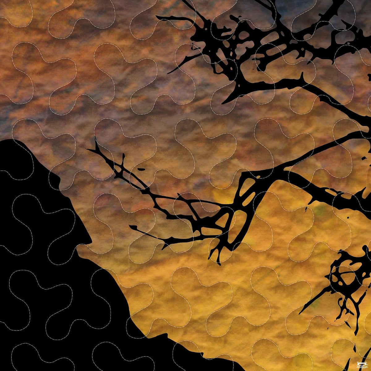Close-up perspective of Bigfoot bedding detailing amber sunset stripes, pine tree graphics, and dark background