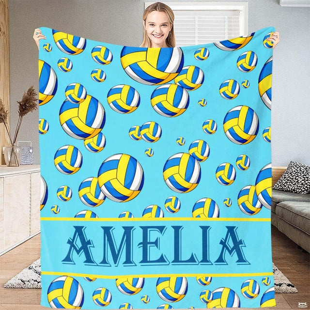 Overhead view of sky blue bedding set styled with colorful panelled volleyball patterns and yellow accent stripes.