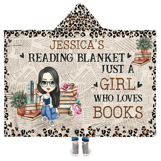 Vintage newsprint motif with stacked thematic accent, pink roses, potted greens, and leopard accents near a bed front setty.
