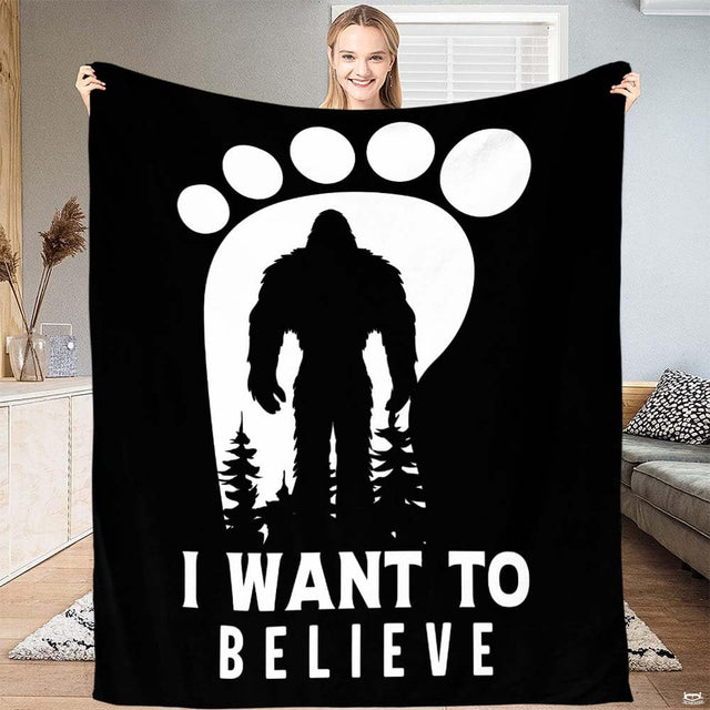Bigfoot footprint silhouette graphic print with pine tree evergreen forest artwork on black bedding.