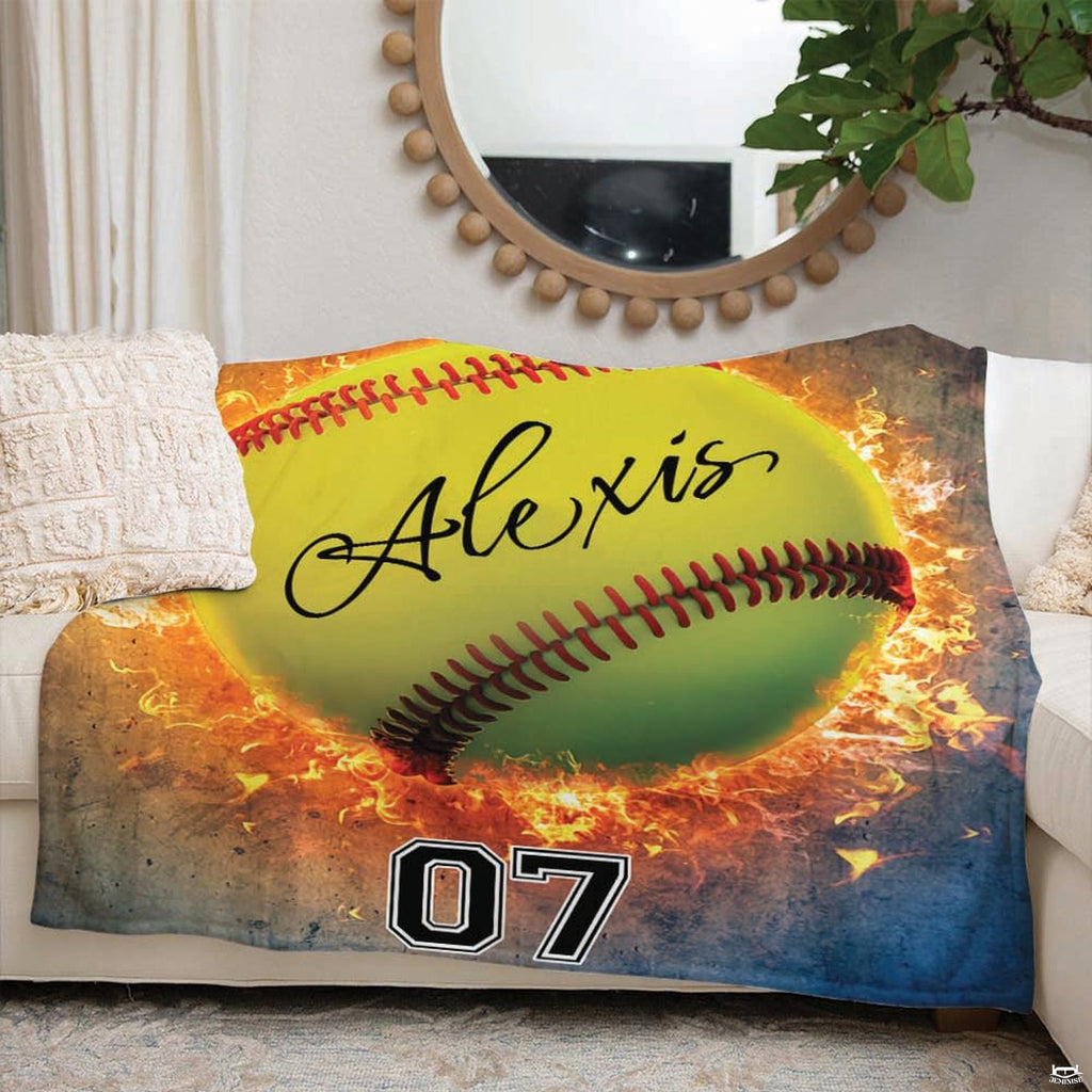 Sports bedroom decor setting featuring flaming softball blanket styled on modern accent seating