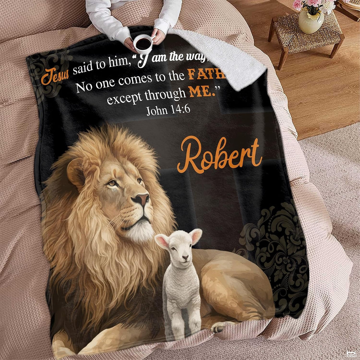 Lion and lamb faith throw blanket styled across a couch in a bright living room.