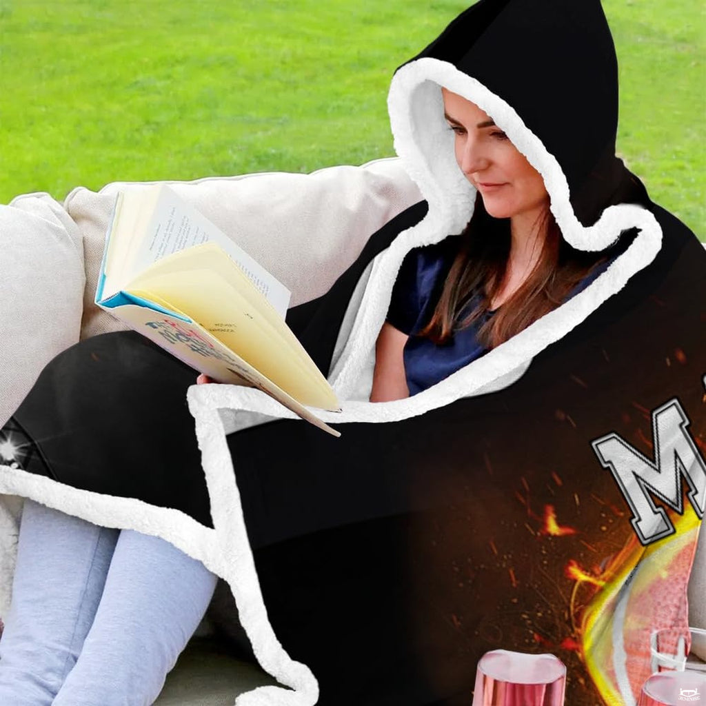 Folded flaming football helmet stadium throw blanket revealing deep black and bright flame graphics