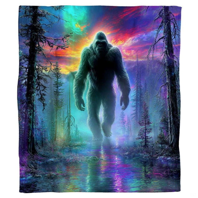 Bigfoot aurora throw blanket view 2 highlighting Sasquatch silhouette, glowing pine forest, and river reflections