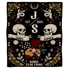 Close-up view of skull detailing, curling ribbon banners, and celestial crescent moon.
