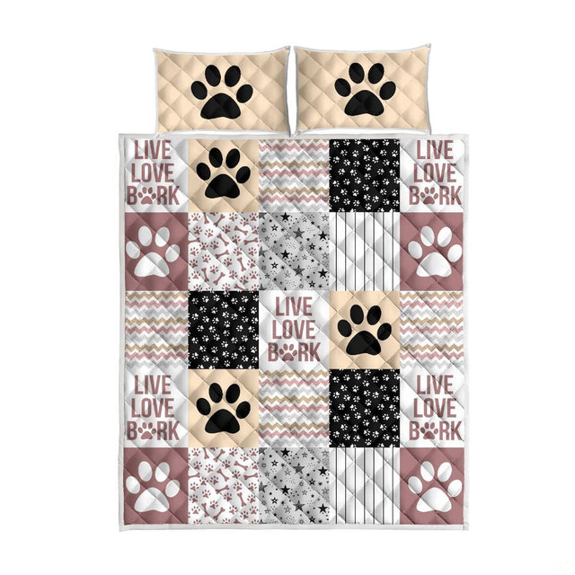 Canine bone and paw prints artwork on dog theme blankets styled in a thematic accent bedroom.