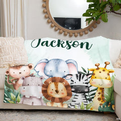 Watercolor safari animals blanket arranged neatly on living room couch beneath mirror.