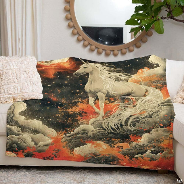 Woman holding open celestial full moon unicorn throw blanket in bright room