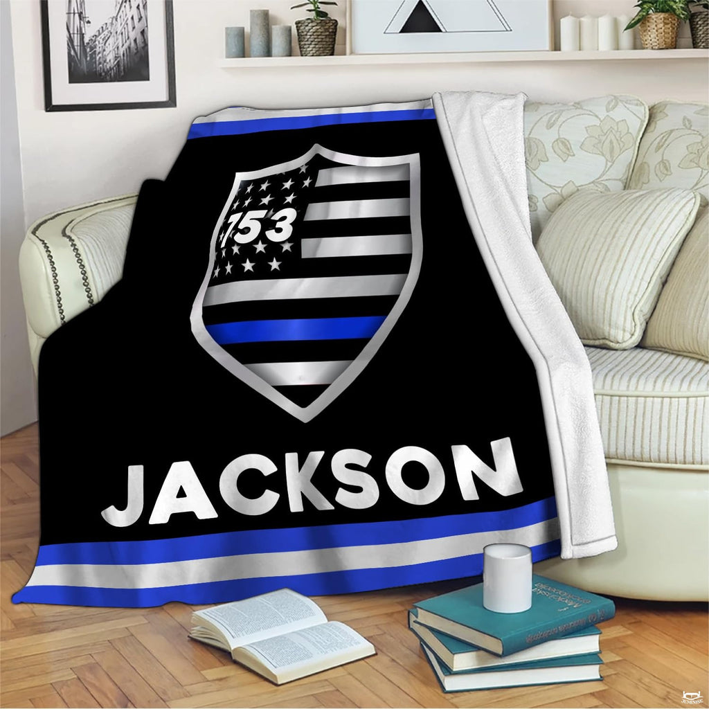 Police tribute flag shield graphic blanket draped across living room couch