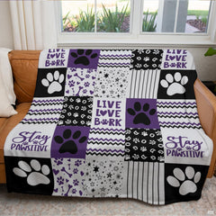 Overhead perspective of modern bedroom decor highlighting purple pet paw prints, stars, and chevron patterned bedding.