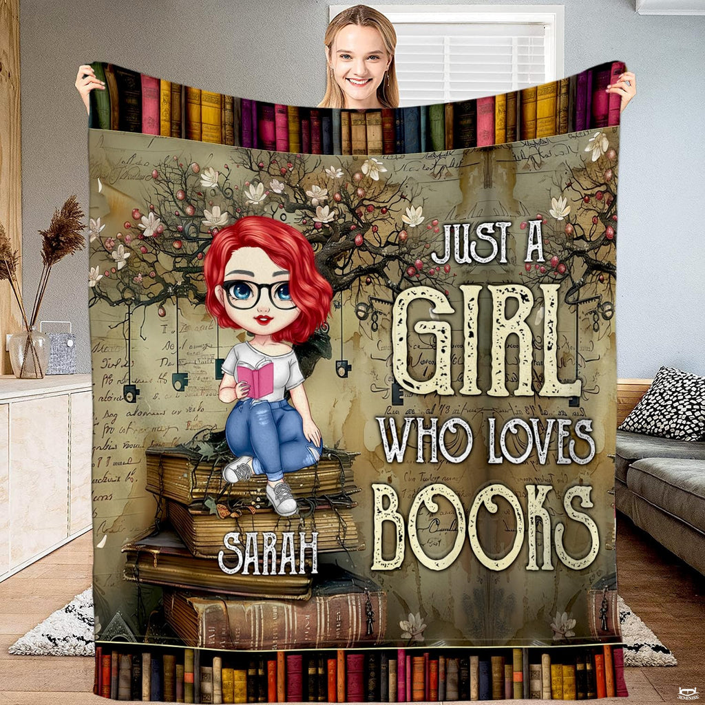 Bedroom staging view showing blossom tree reader girl throw blanket arranged on a bed.
