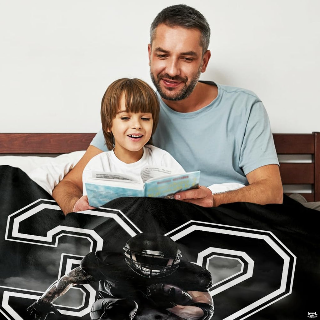 Monochromatic gridiron sports graphics creating a dramatic focal point across a football-themed bed.