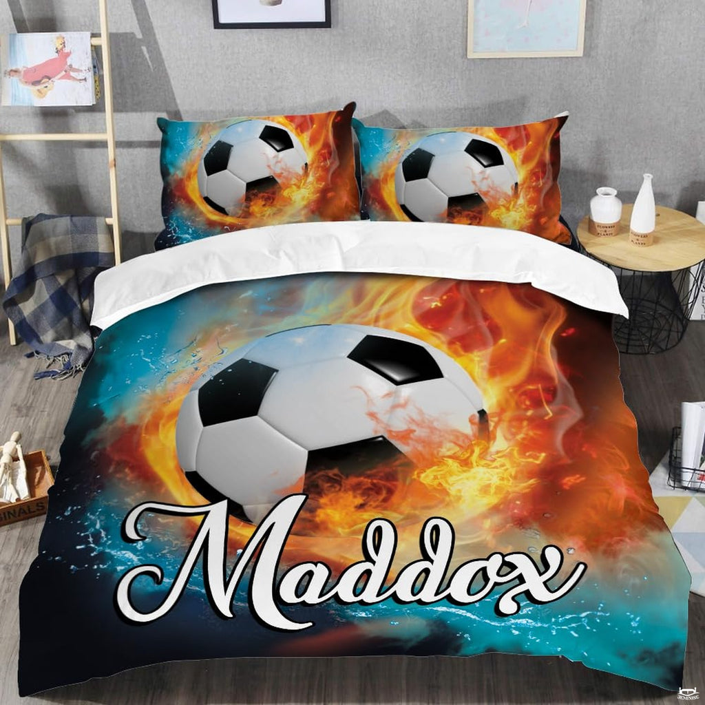 Close-up perspective of soccer bedding detailing blazing amber flames, water droplet splashes, and ball graphics