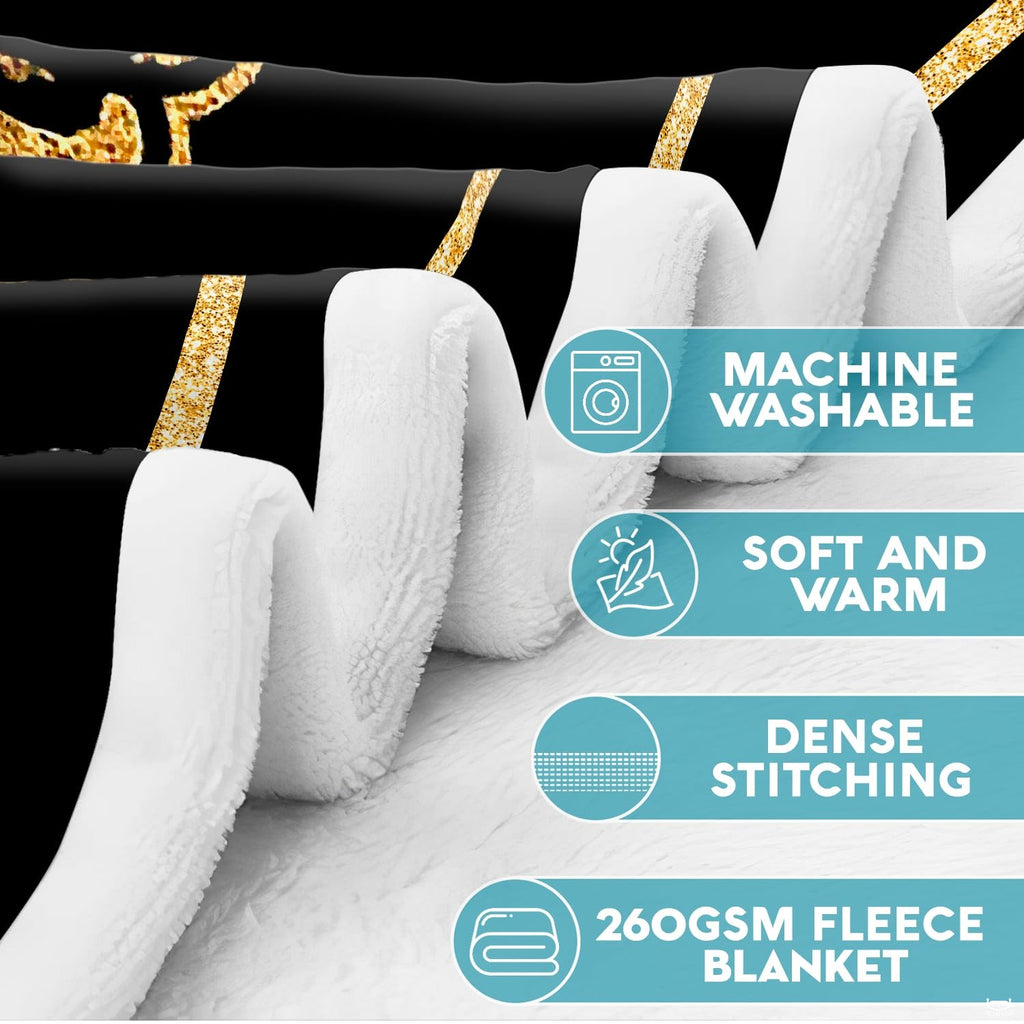 Gold skeleton lovers throw blanket folded neatly showing gold crescent moon and dark aesthetics