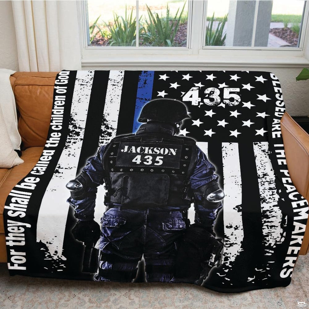 Contrasting black and blue patriotic law enforcement artwork displayed gracefully across room decor.