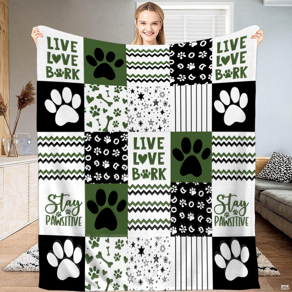 Dog paw bedding set featuring an olive green, black, and white patchwork grid motif with stars and chevron artwork.
