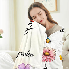 Close-up of butterfly floral bedding showcasing delicate watercolor wings and romantic cursive lettering.
