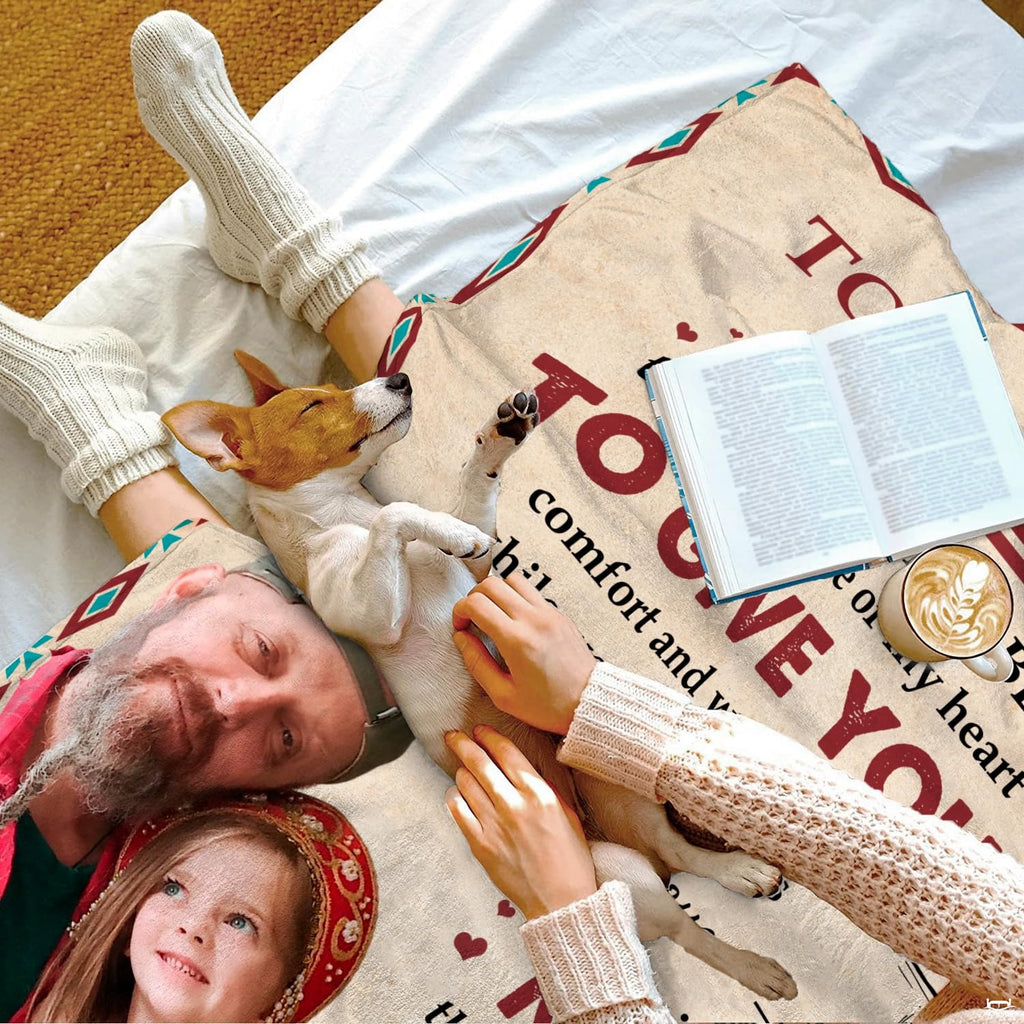 Bedroom scene showing family parchment artwork on bed beside sleeping pup and morning beverage.