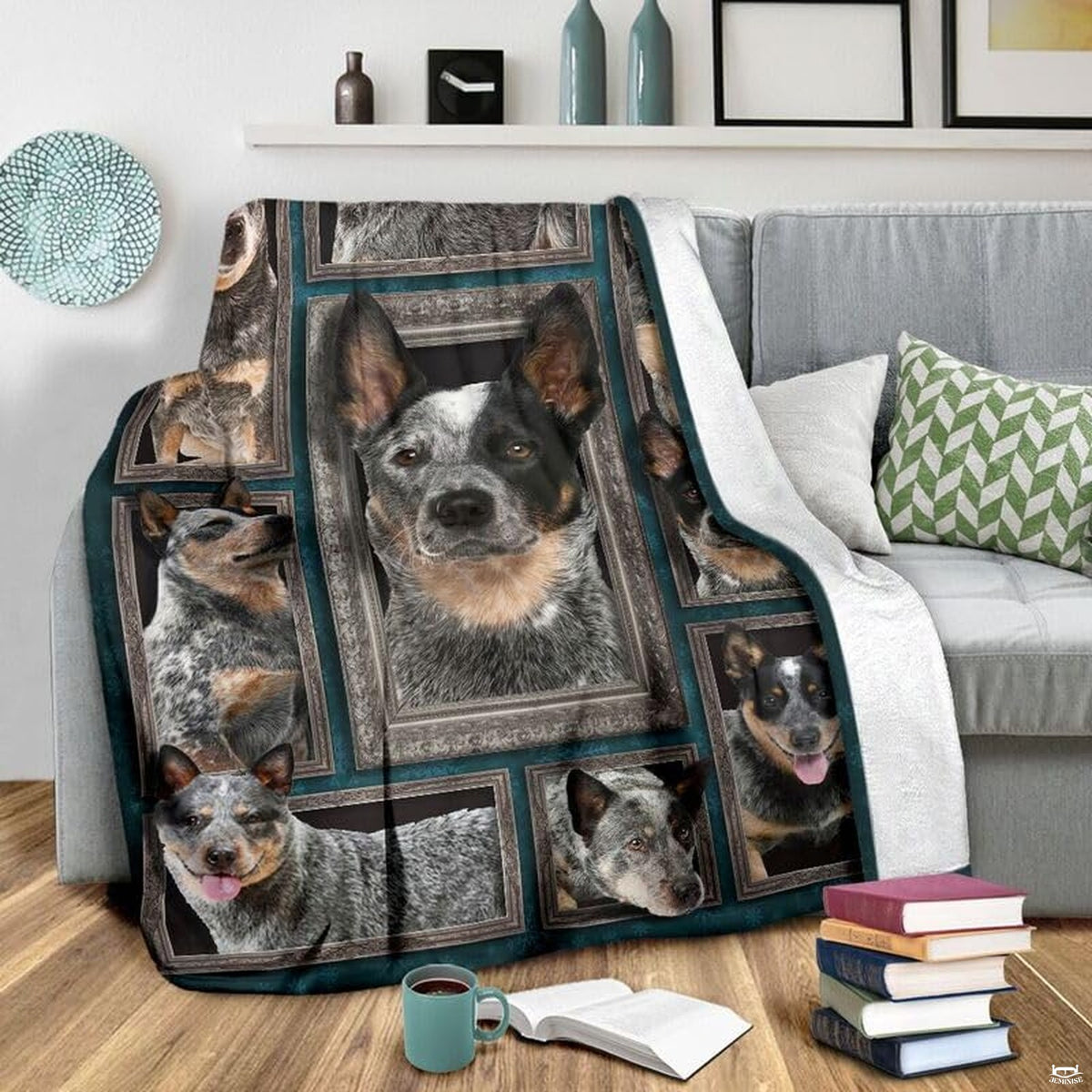 Grey couch arrangement featuring the Australian Cattle Dog blanket draped beside patterned pillows.