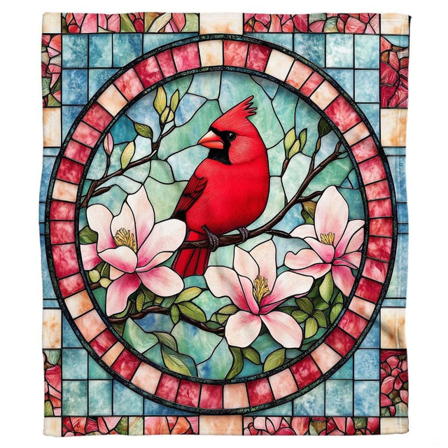 Living room sofa displaying the stained glass red cardinal and magnolia flowers throw blanket.