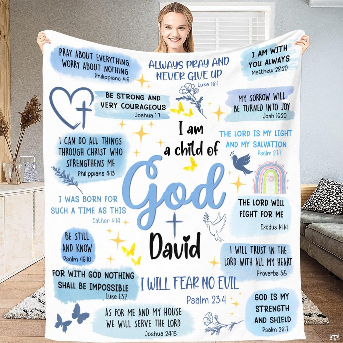 Inspirational blue watercolor faith graphic with doves and rainbow held open in a bright room