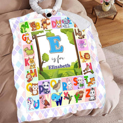 Illustrated A to Z cute animal alphabet chart surrounding central woodland meadow landscape, view 7.