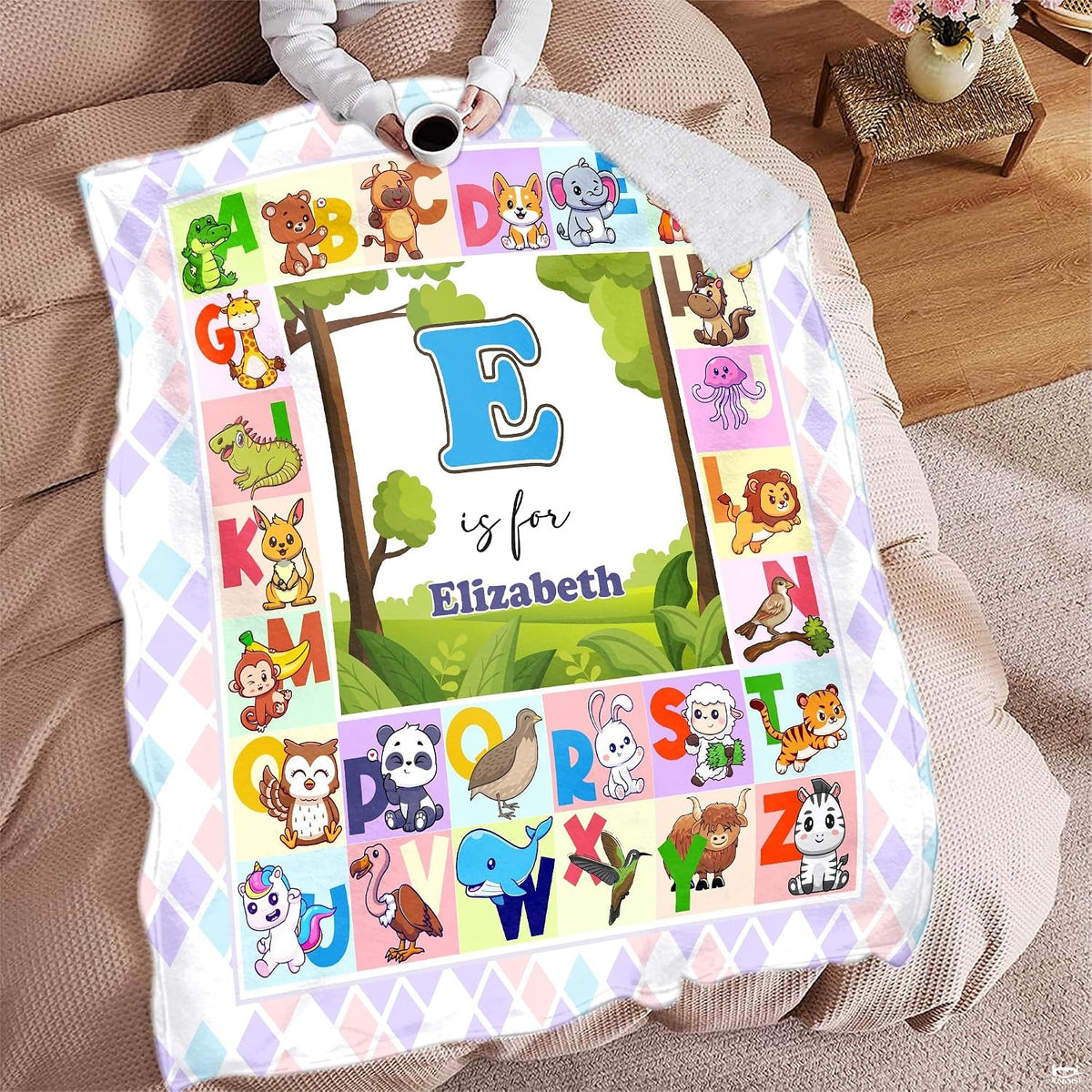 Illustrated A to Z cute animal alphabet chart surrounding central woodland meadow landscape, view 7.