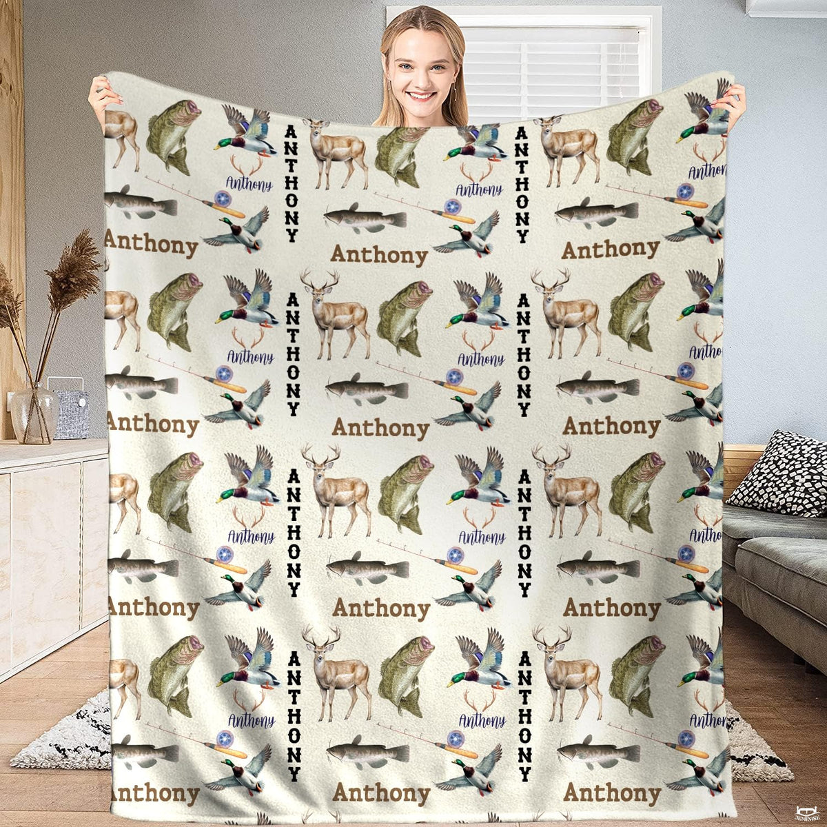 Model holding the rustic wildlife hunting and fishing throw blanket in a contemporary living room