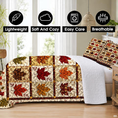 Matching pillow shams displaying a miniature maple leaf patchwork grid on a bedding set
