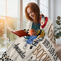 Close-up shot of newsprint texture and colorful book spines on reader girl throw blanket.