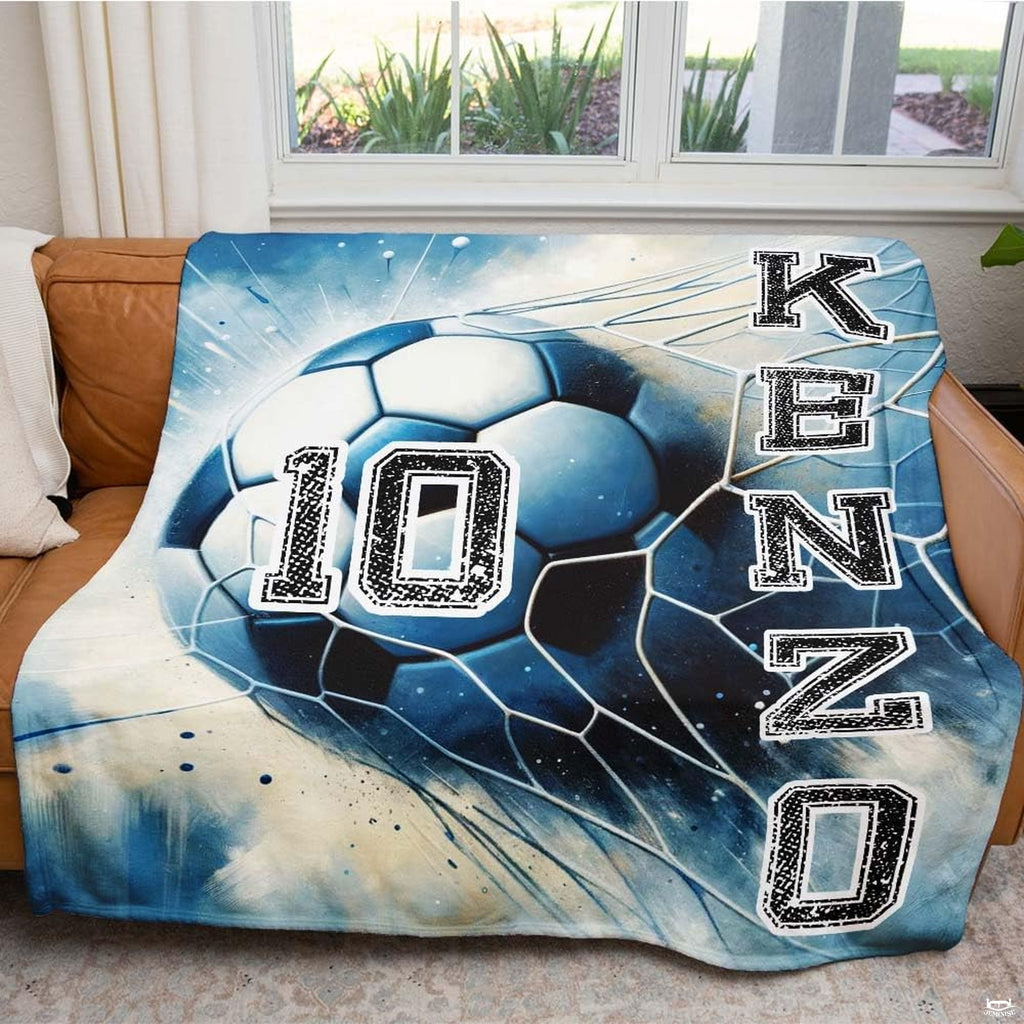 Detailed view of the soccer ball hitting the net with blue motion accents on dark background.