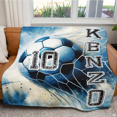 Detailed view of the soccer ball hitting the net with blue motion accents on dark background.